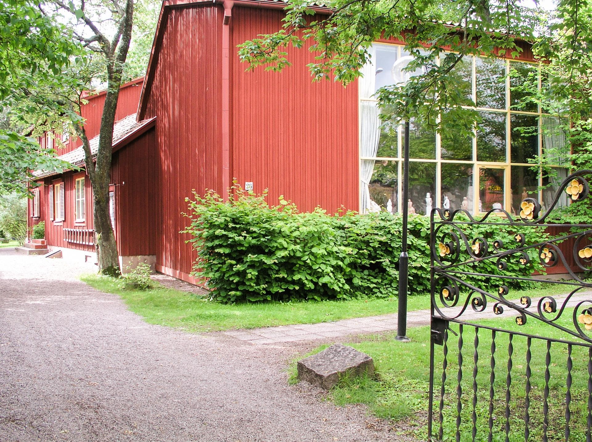 Studio museum Bror Hjorths Hus. Red wooden villa with large studio windows. 